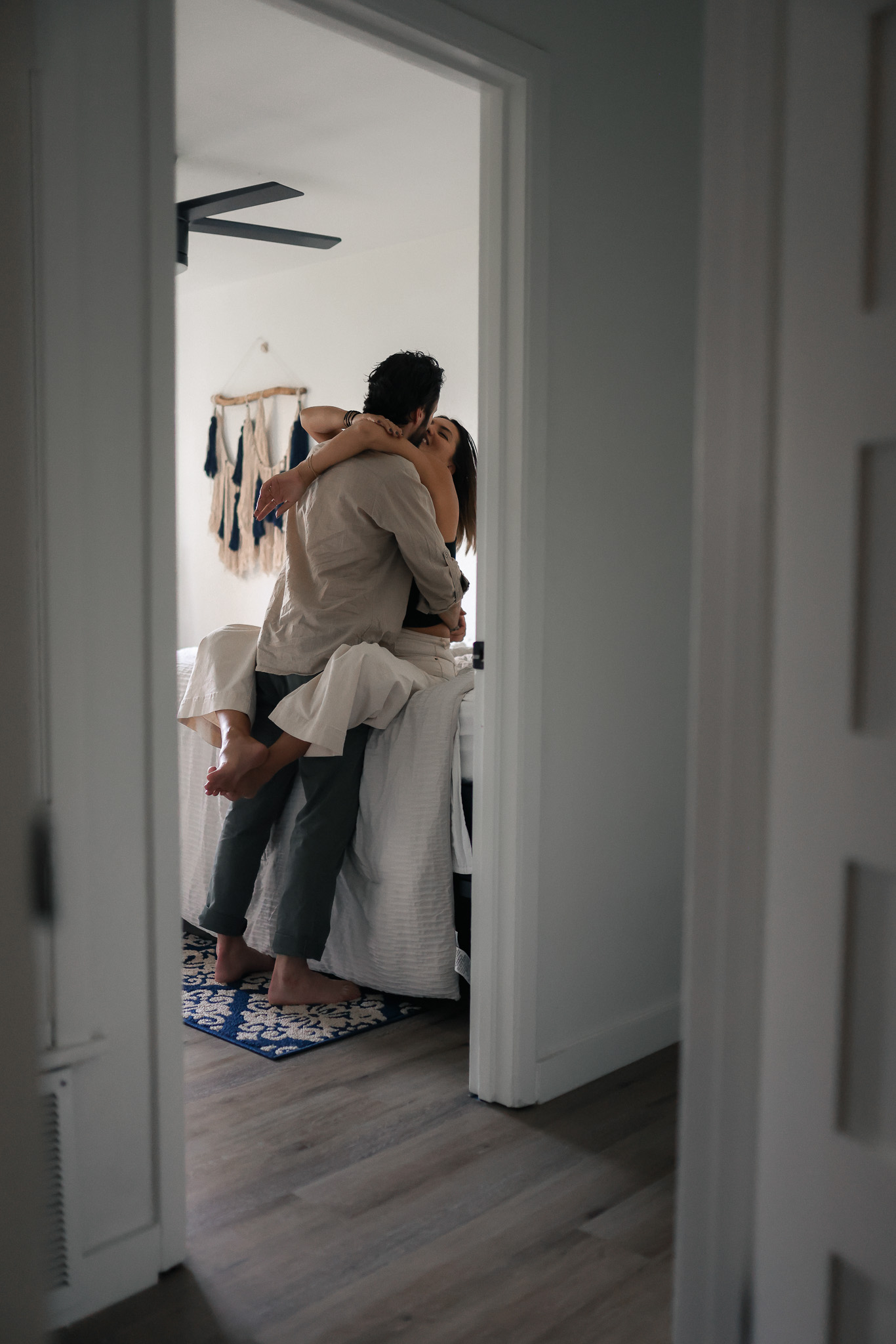 in-home engagement photo of a couple captured by Austin engagement photographer