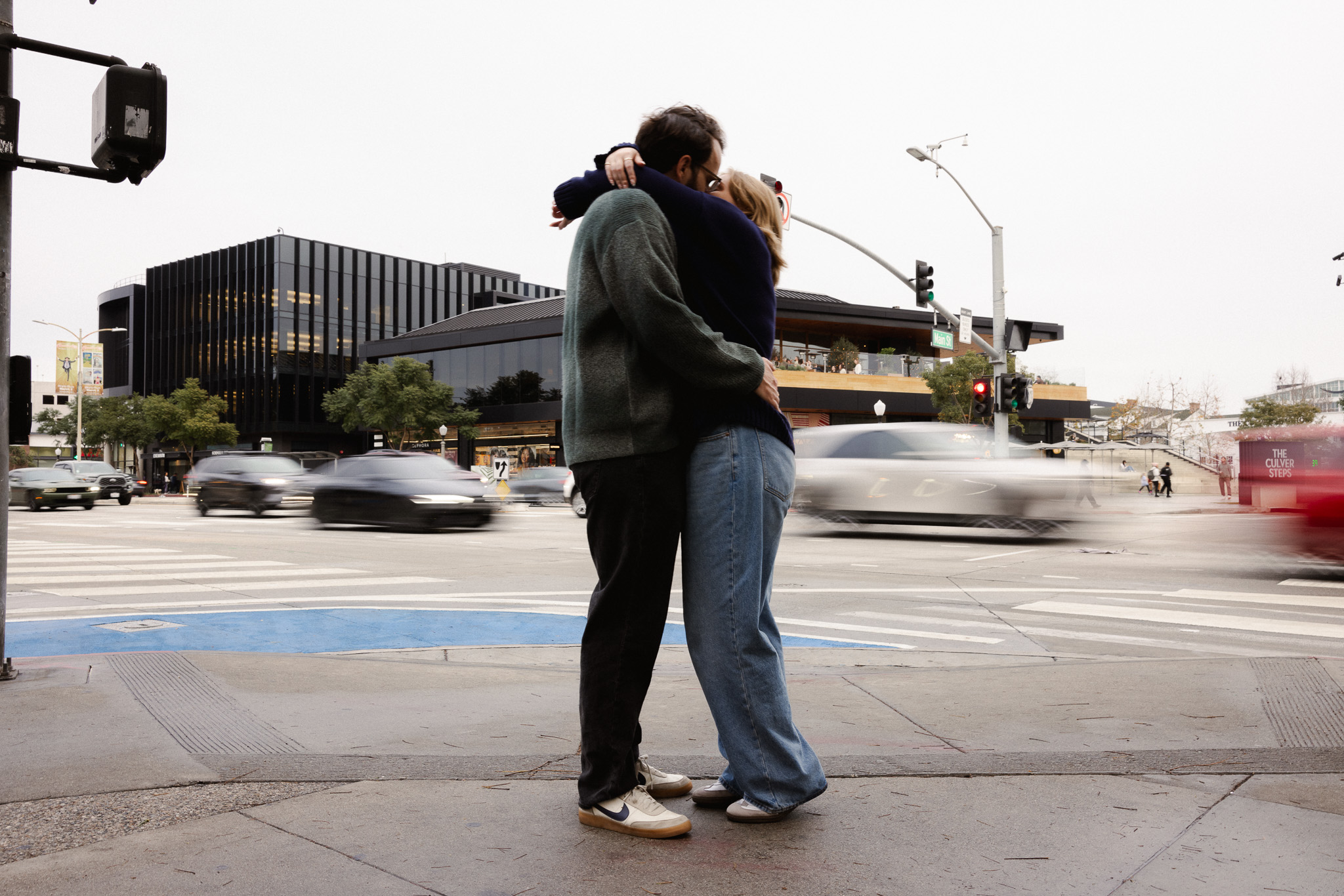 engagement photo of a young couple in Culver City, captured by Los Angeles documentary wedding photographer