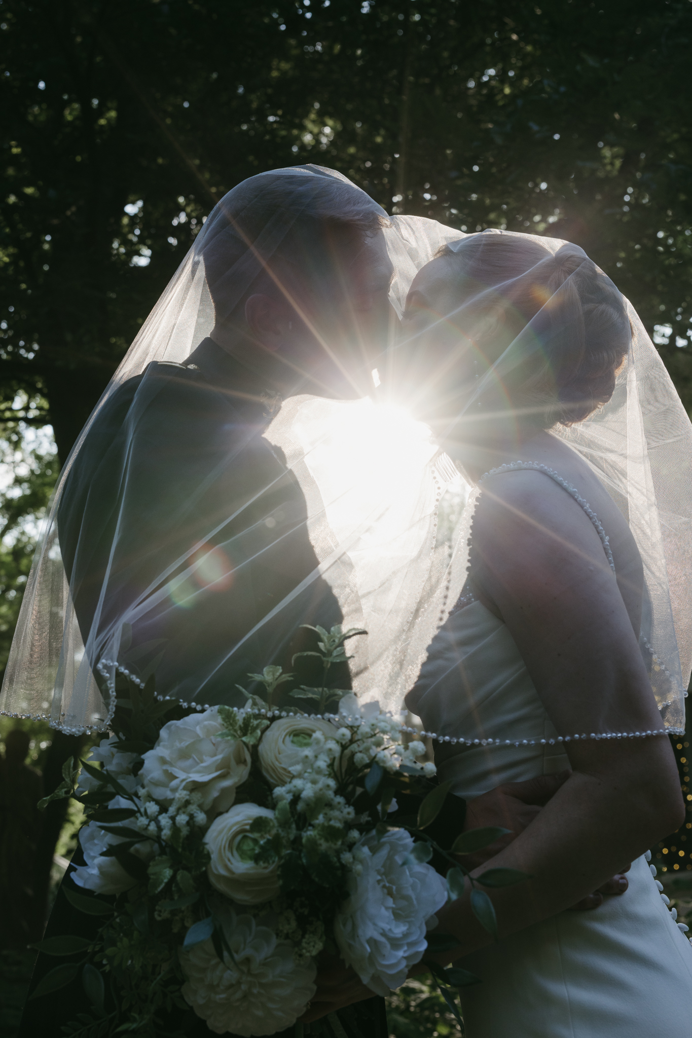 An under the veil shot of a bride and groom at Casa Blanca Brushy Creek shot by Austin and Los Angeles editorial wedding photographer