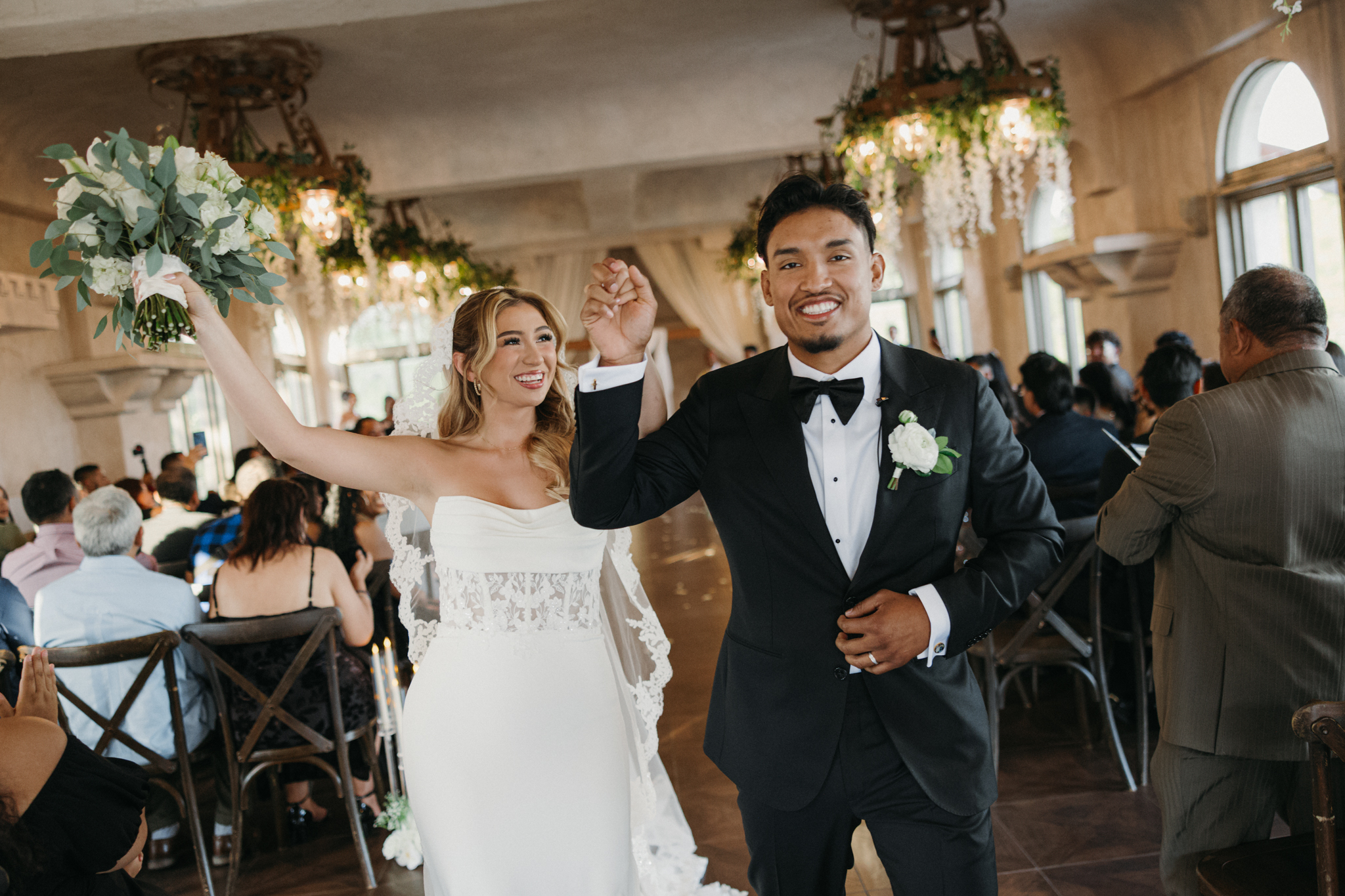 bride and groom walking down the aisle at Villa Antonia captured by Austin documentary wedding photographer