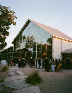 Film photograph of Barr Mansion in Austin, Texas, surrounded by lush greenery and soft natural light.