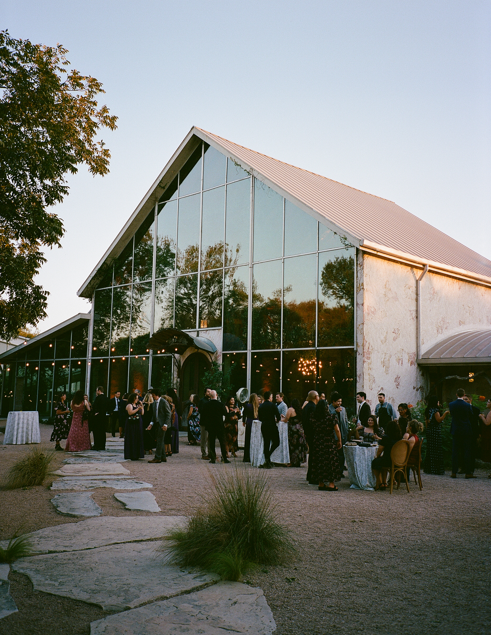 Film photograph of Barr Mansion in Austin, Texas, surrounded by lush greenery and soft natural light.