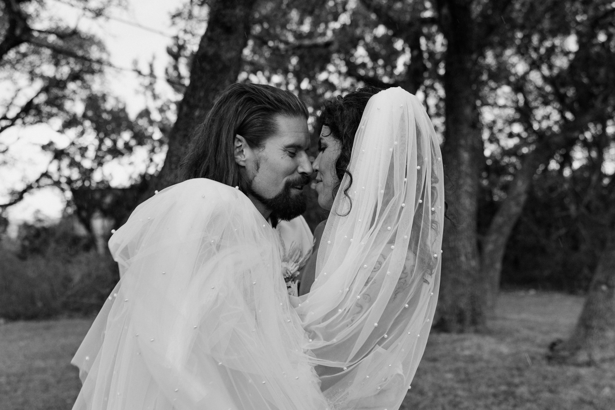 A romantic moment with a just-married couple, captured by California candid film wedding photographer.